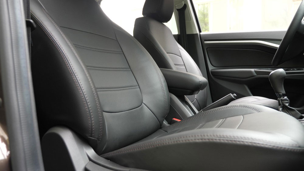 A luxury car interior with high-quality seat covers installed.